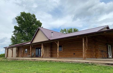 Sticks & Stones hand-notched cedar log cabin work